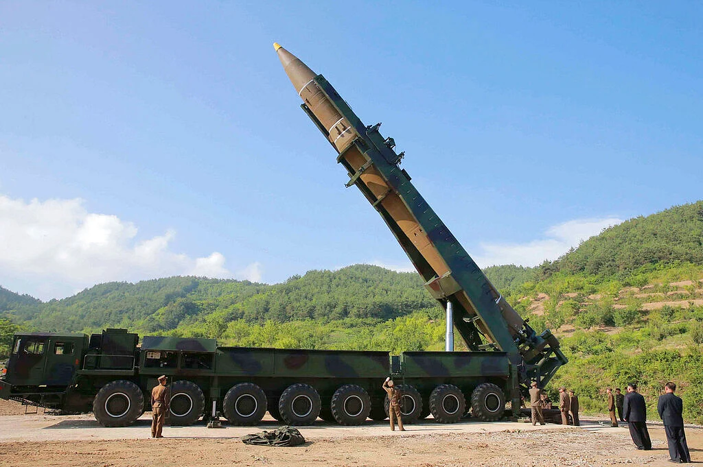 In this 4 July 2017 photo distributed by the North Korean government, Kim Jong Un, second from right, inspects the preparation of the launch of a Hwasong-14 intercontinental ballistic missile (ICBM) in North Korea’s northwest. 