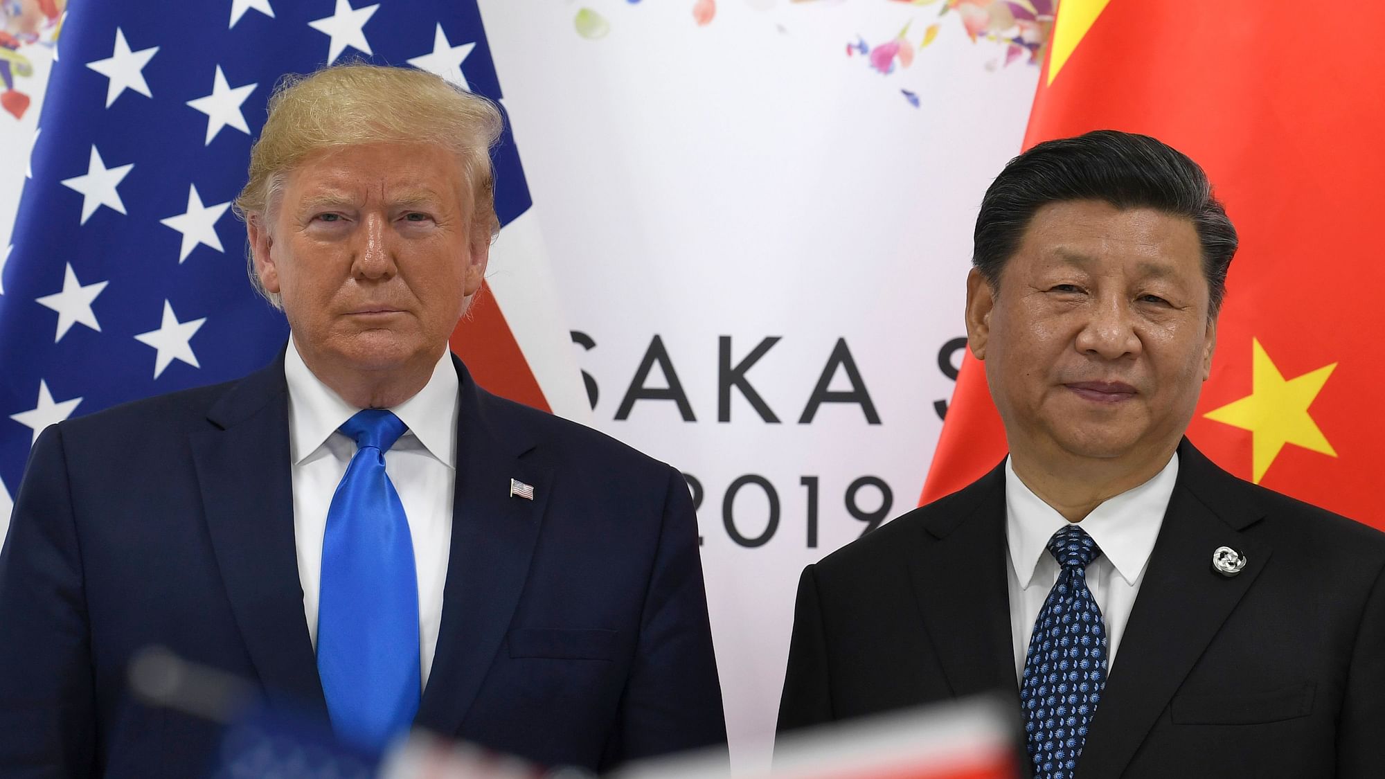 President Donald Trump, left, poses for a photo with Chinese President Xi Jinping during a meeting on the sidelines of the G-20 summit in Osaka, Japan, Saturday, June 29, 2019.
