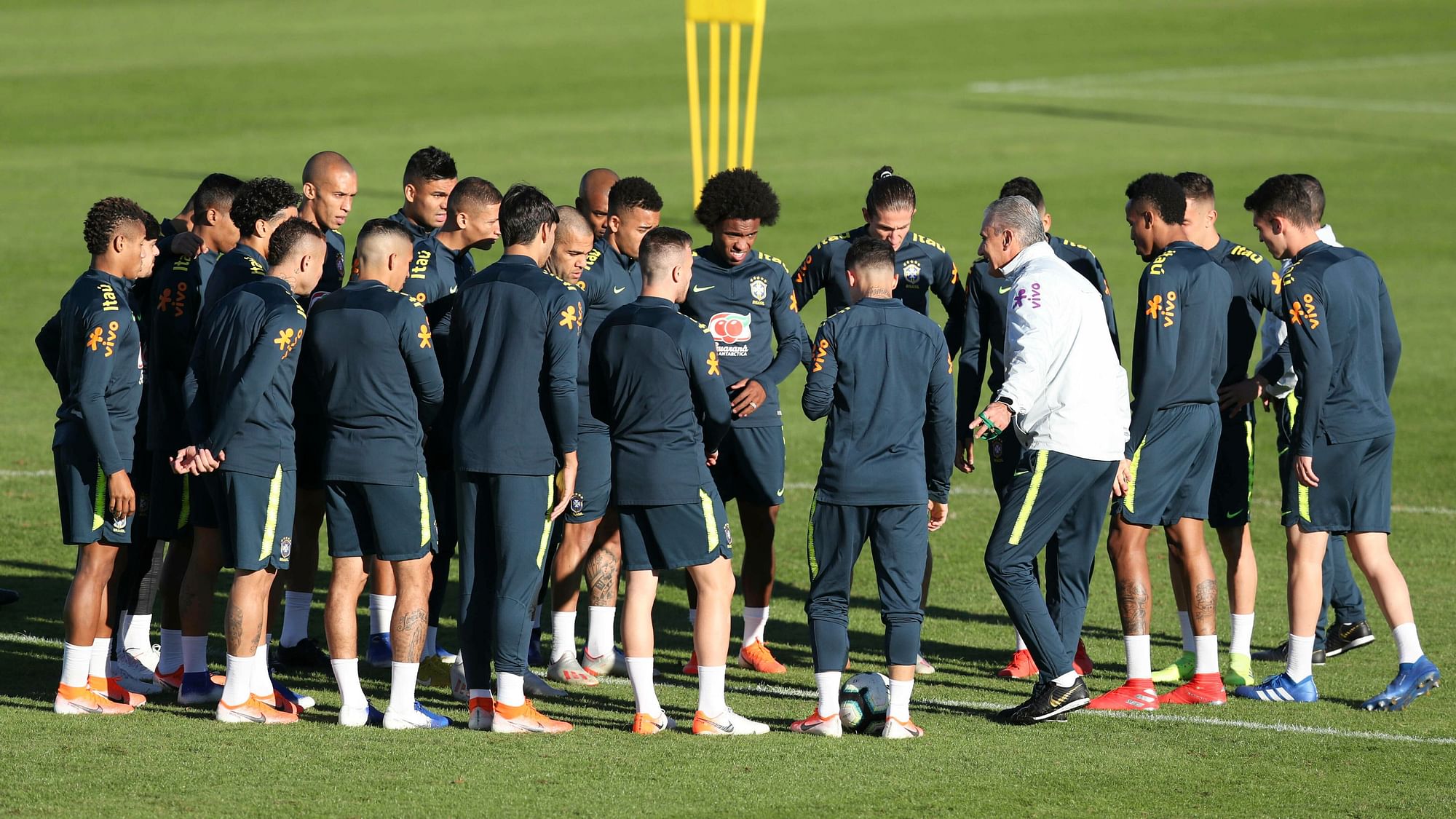 Brazil’s coach Tite, third from right, gather his players during a training session in Porto Alegre.