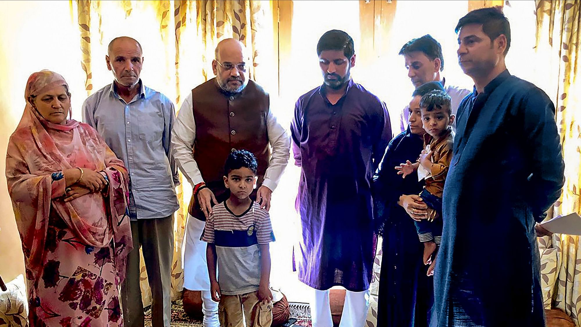 Home Minister Amit Shah meets with the family of the family of SHO Anantnag Arshad Khan who had lost his life in a terror attack on 12 June.