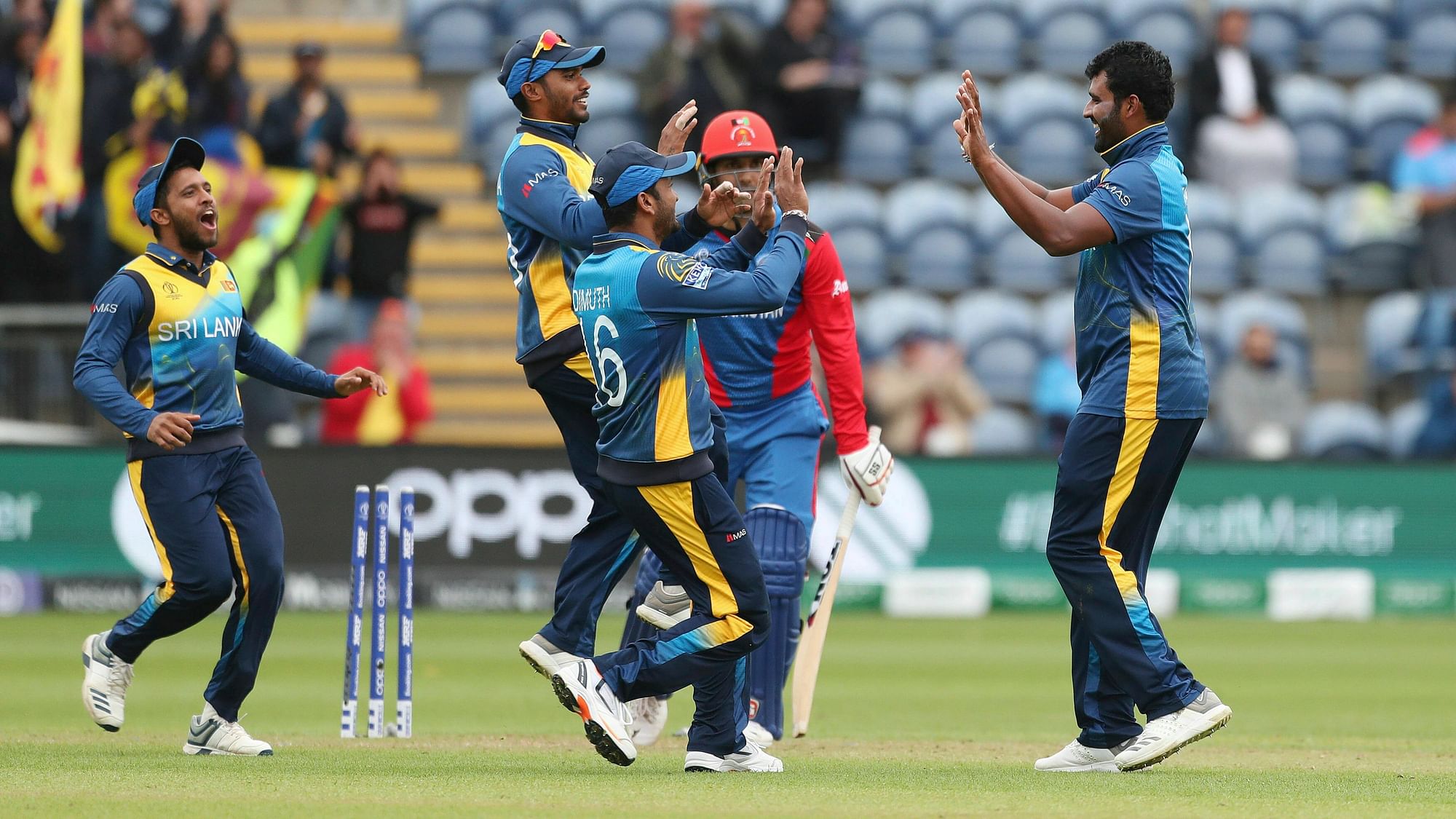 Sri Lankan players celebrate the wicket of Mohammed Nabi.&nbsp;