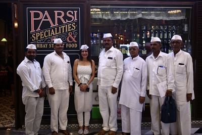 Mumbai: Chef Anaida Parvaneh with fellow Dabbawalas outside restaurant chain SodaBottleOpenerWalaa