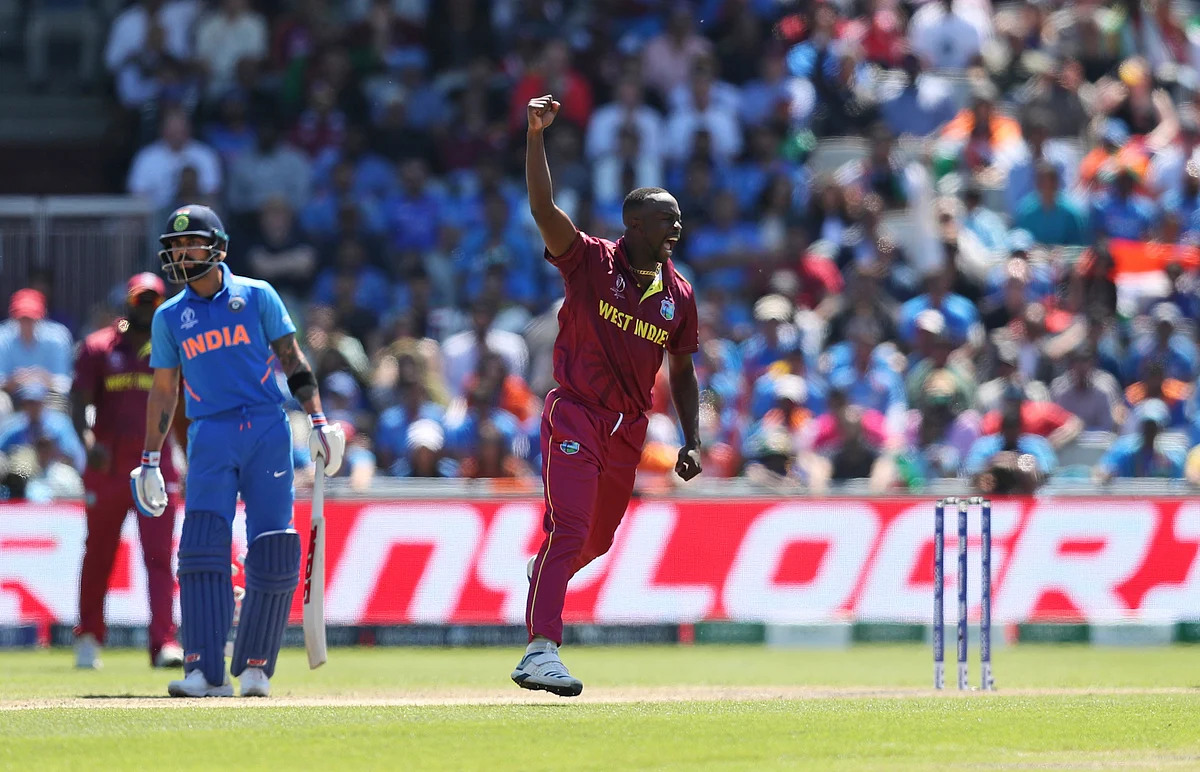 West Indies’ Kemar Roach celebrates the dismissal of India’s Vijay Shankar.
