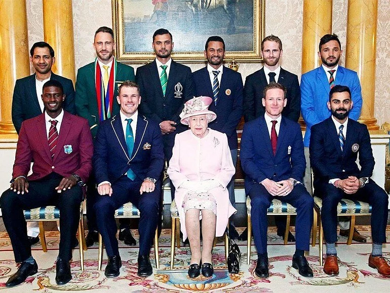 The original photo of the Queen Elizabeth with the serving captains for teams.