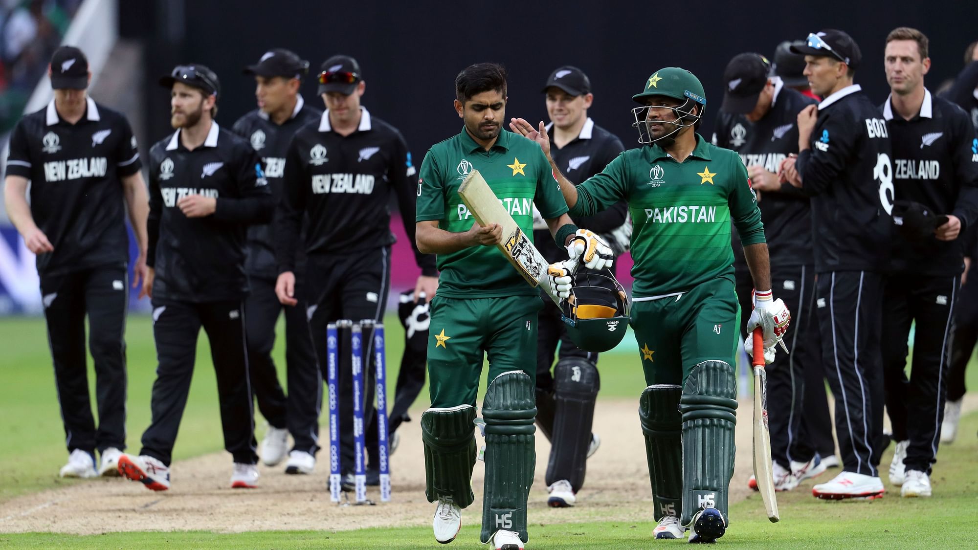 Pakistan’s captain Sarfaraz Ahmed, right, pat on the shoulder, teammate Babar Azam for scoring a century at the end the Cricket World Cup match between New Zealand and Pakistan.