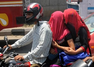 Jammu: Women cover their heads so as to avoid direct sun contact in Jammu. (Photo: IANS)