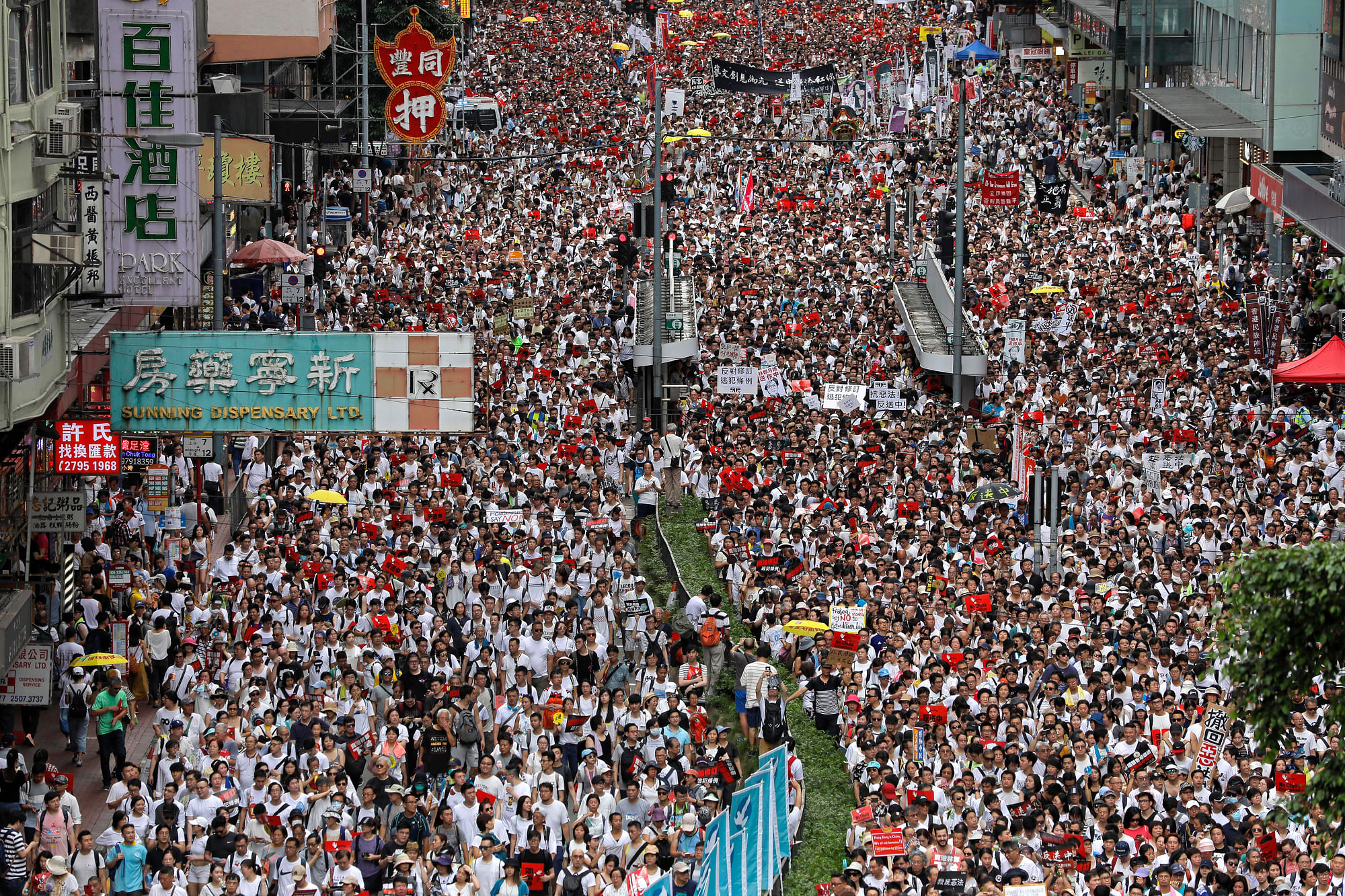 Protesters march against the proposed amendments to Hong Kong’s extradition law.