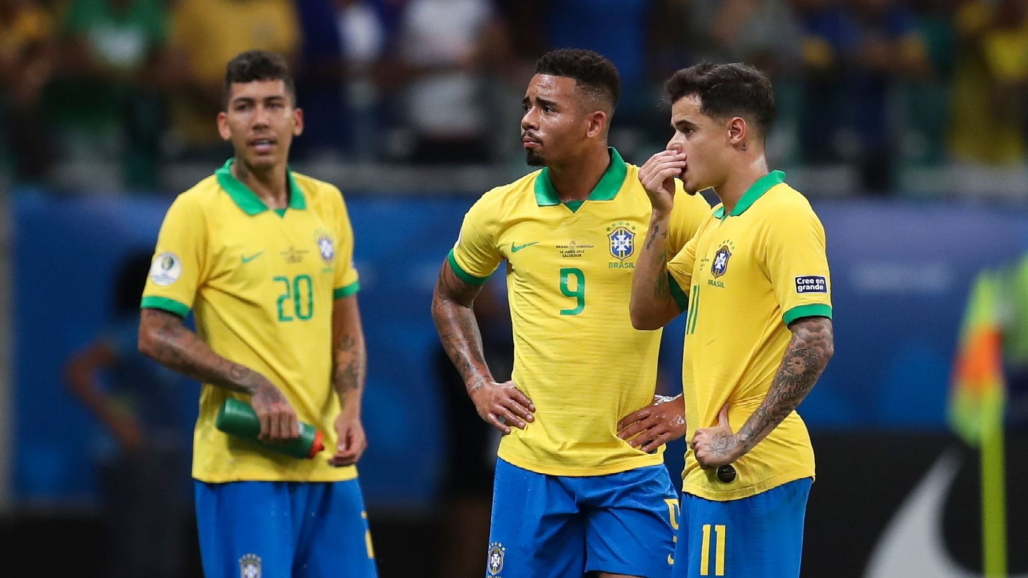 Brazil’s Gabriel Jesus (Center) waits for the referee to decide on his goal with teammates Roberto Firmino (Left) and Brazil’s Philippe Coutinho (Right) during a Copa America Group A soccer match at the Arena Fonte Nova in Salvador.