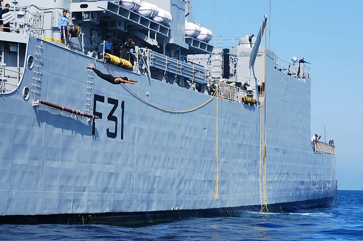 Free Philly! Rear Admiral Philipose Pynumootil takes a leap of faith from a warship at sea.