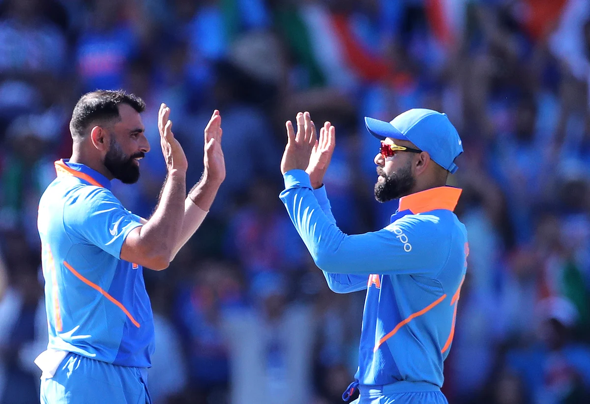 India’s Mohammed Shami, left, celebrates with captain Virat Kohli the dismissal of West Indies’ Shimron Hetmyer during the Cricket World Cup match between India and West Indies.