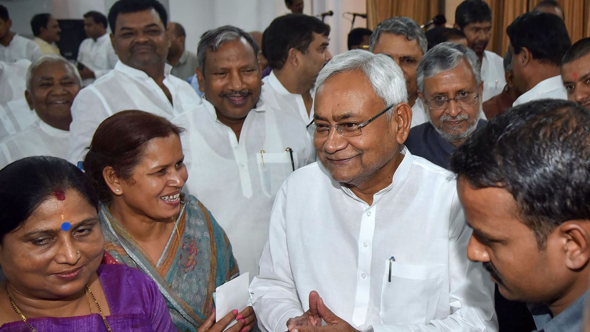 Bihar CM Nitish Kumar along with deputy CM Sushil Kumar Modi during the swearing-in ceremony for the Cabinet expansion  in Patna.