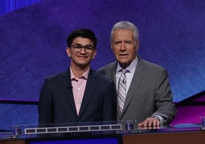 Avi Gupta, left, who won the $100,000 Teen Jeopardy quiz show contest prize, left, with the programme
