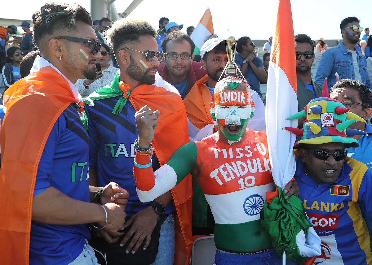 Indian supporters cheer for their team before the start of the Cricket World Cup match between India and West Indies at Old Trafford in Manchester, England.