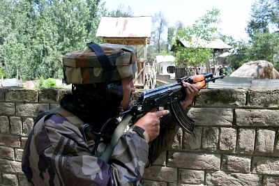 Pulwama: A soldier takes position during a gunfight with holed up militants in Jammu and Kashmir