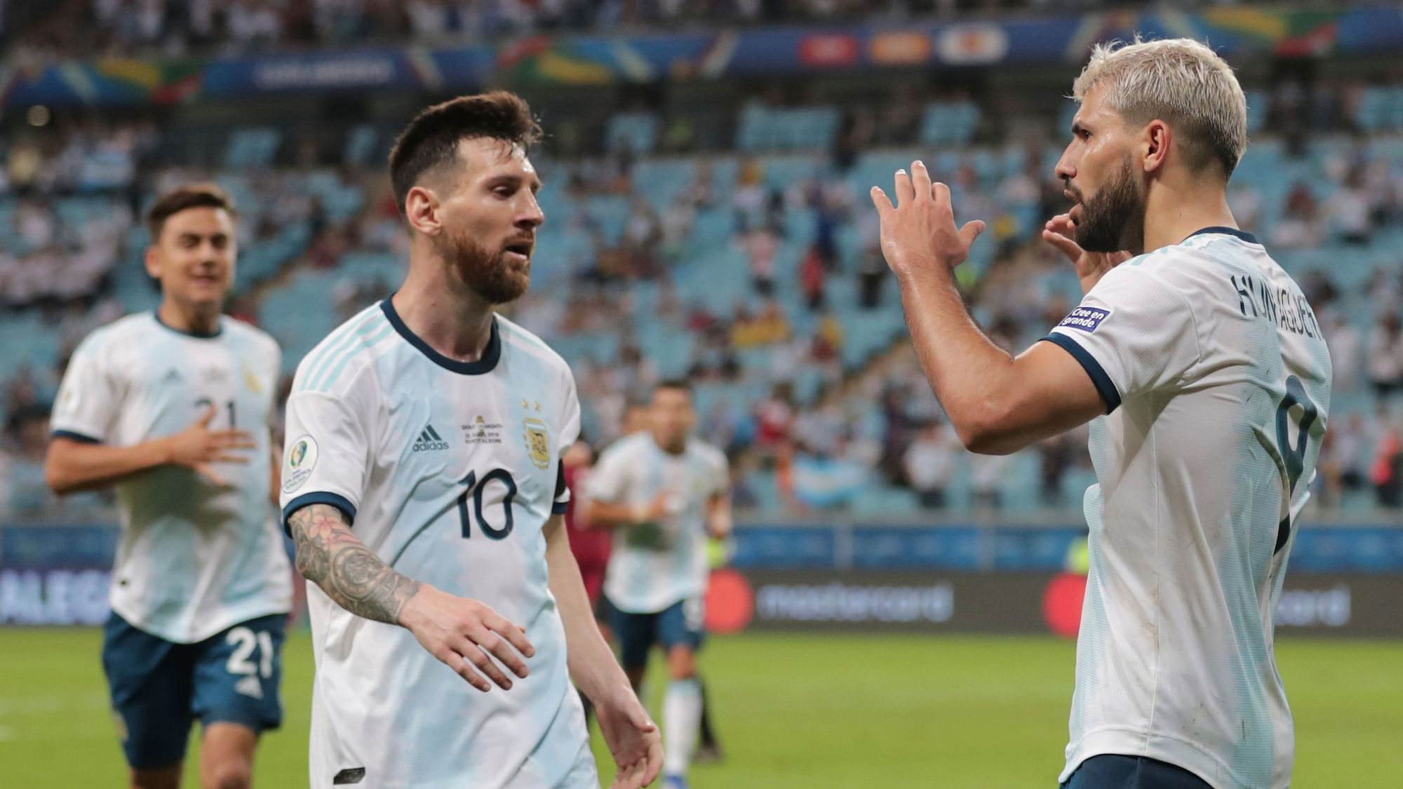 Argentina’s Sergio Aguero, right, celebrates with his teammate Lionel Messi after scoring their side’s second goal against Qatar.