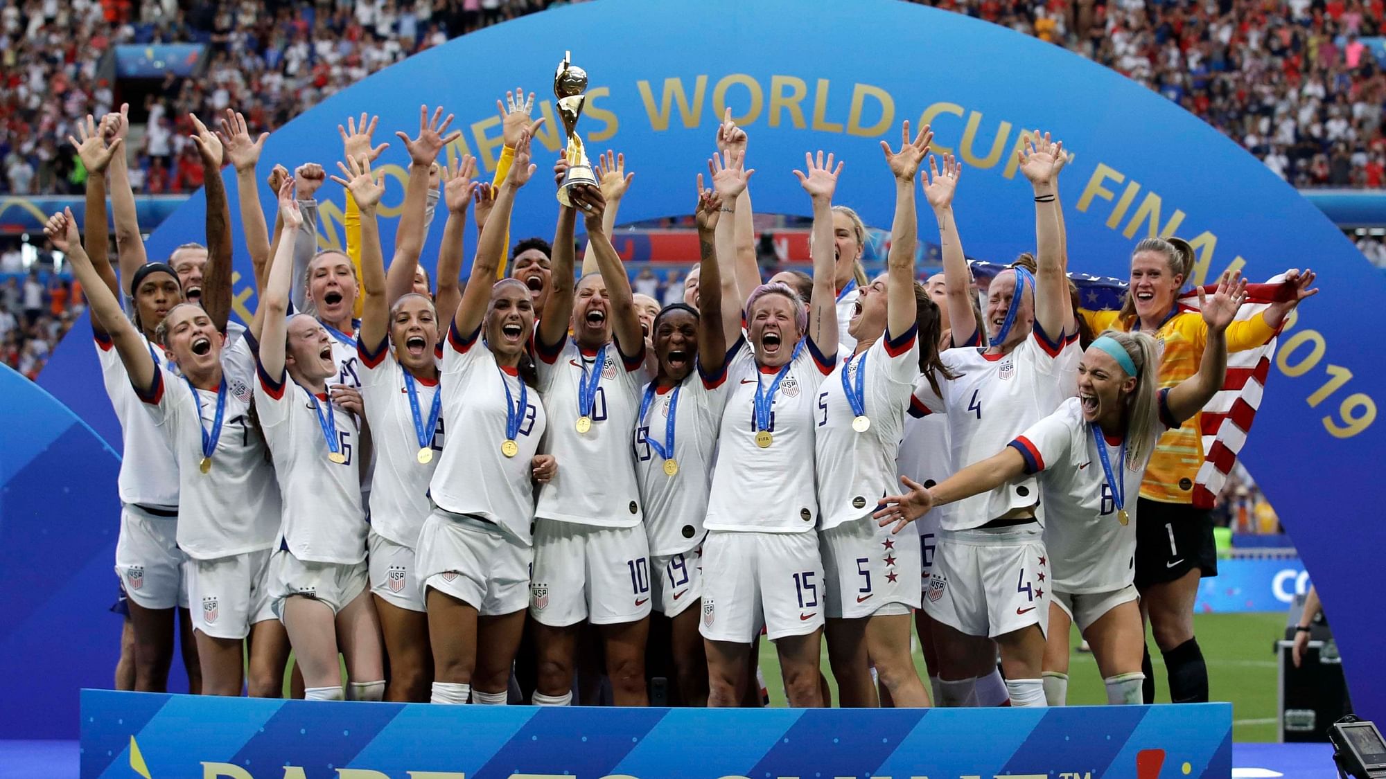  United States team celebrates with trophy after winning the Womens World Cup final soccer match between US and The Netherlands at the Stade de Lyon in Decines, France