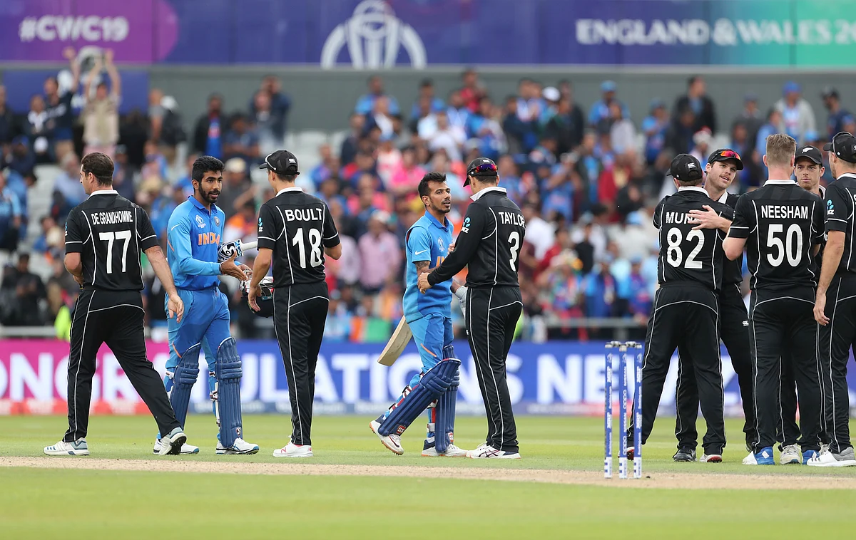 New Zealand players greet Indian batsmen Jasprit Bumrah, second left, and Yuzvendra Chahal, fourth left, after their win in the Cricket World Cup semi-final match between India and New Zealand at Old Trafford in Manchester, England, Wednesday, July 10, 2019. 