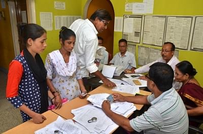 Guwahati: People who were not included in the complete draft National Register of Citizens (NRC), collect application forms to re-apply for their names to be included in the NRC draft, at NRC Sewa Kendra (NSK) Hatigaon, in Guwahati on Aug 20, 2018. (Photo: IANS)