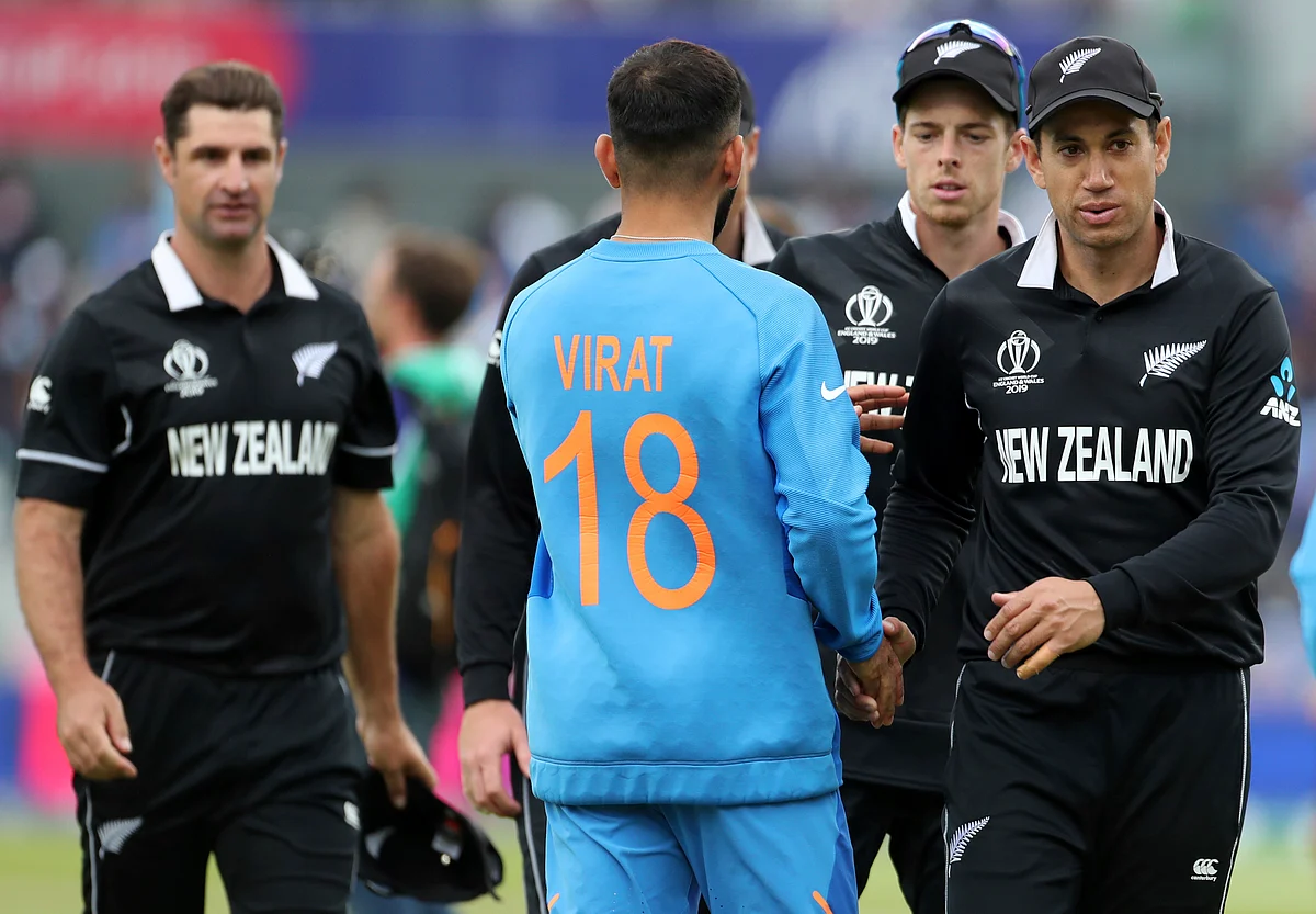 India’s captain Virat Kohli, second left, congratulate New Zealand players on their win in the Cricket World Cup semi-final match between India and New Zealand at Old Trafford in Manchester, England, Wednesday, July 10, 2019. 