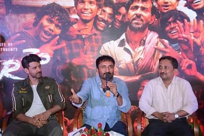 Patna: Mathematician Anand Kumar accompanied by actor Hrithik Roshan, addresses during the promotions of the film "Super 30" in Patna on July 16, 2019. (Photo: IANS)