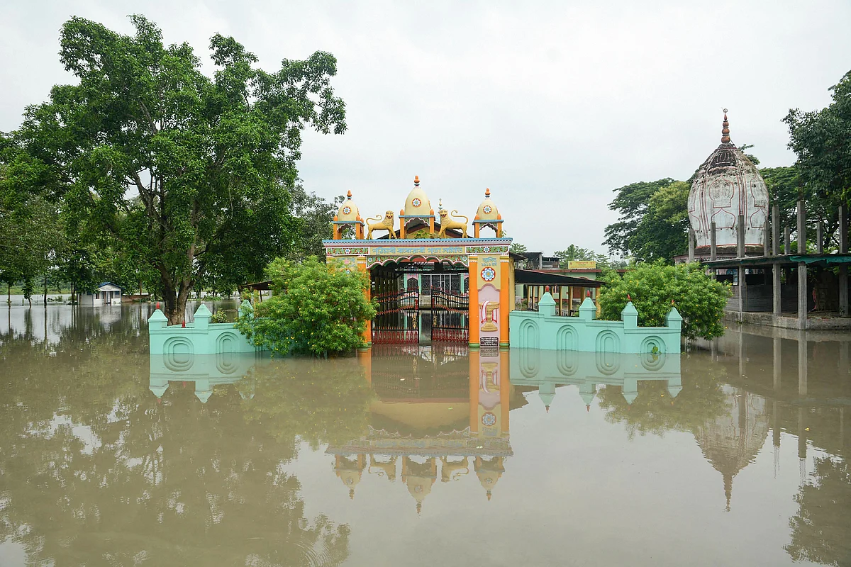 A temple is seen half submerged under flood waters, following heavy monsoon rain, in Kamrup district, Friday, 12 July.
