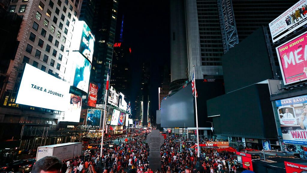 Screens in Times Square go black during a power outage on 13 July 2019 in New York.&nbsp;