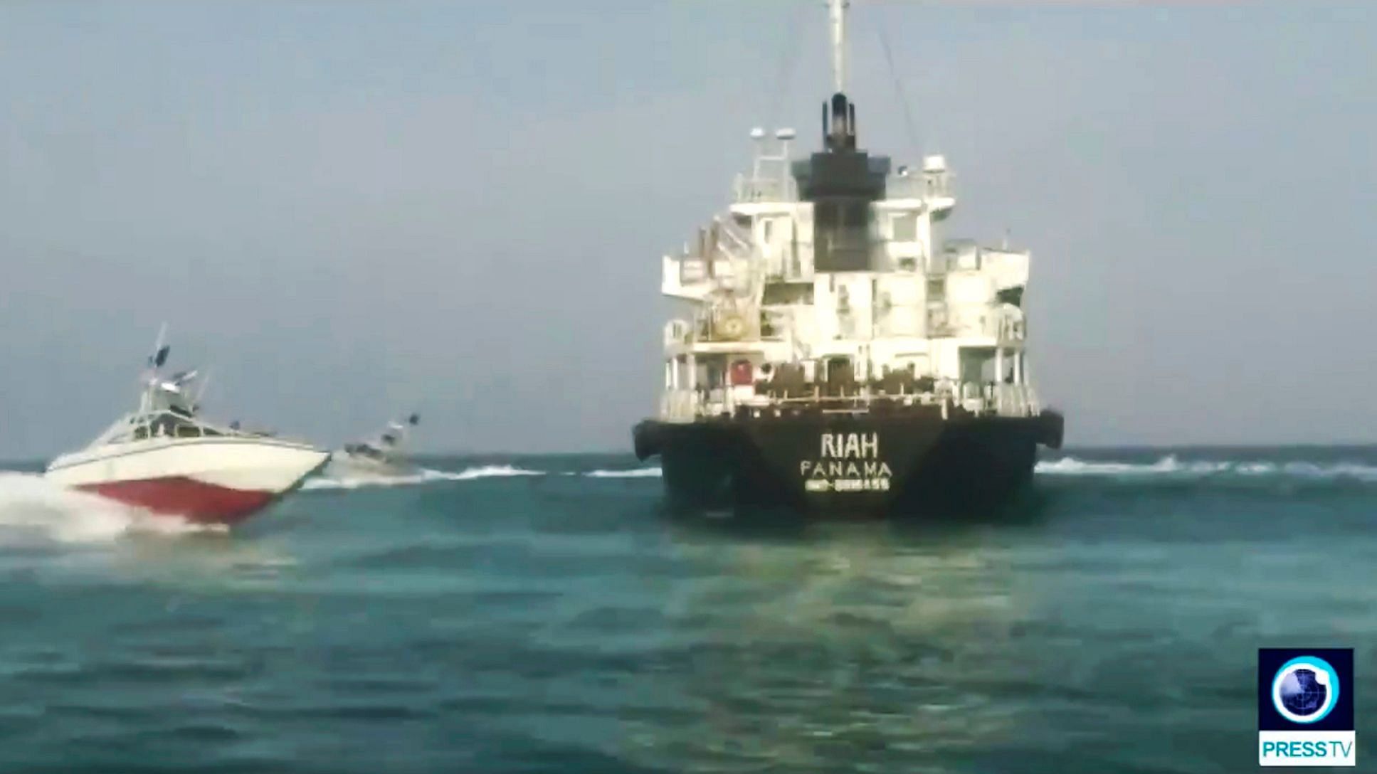 Panamanian-flagged oil tanker MT Riah surrounded by Iranian Revolutionary Guard vessels.