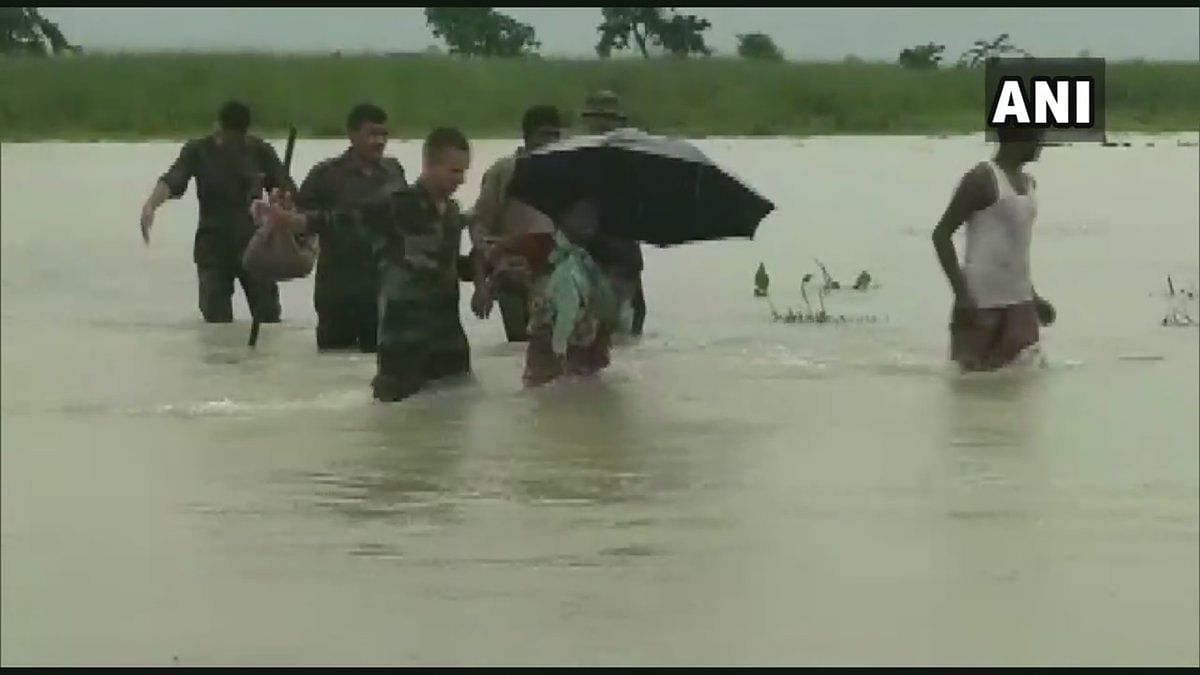 Jawans of the  Indian Army rescued locals who were stuck in the flood in the Runikhata area of Chirang district in Assam.