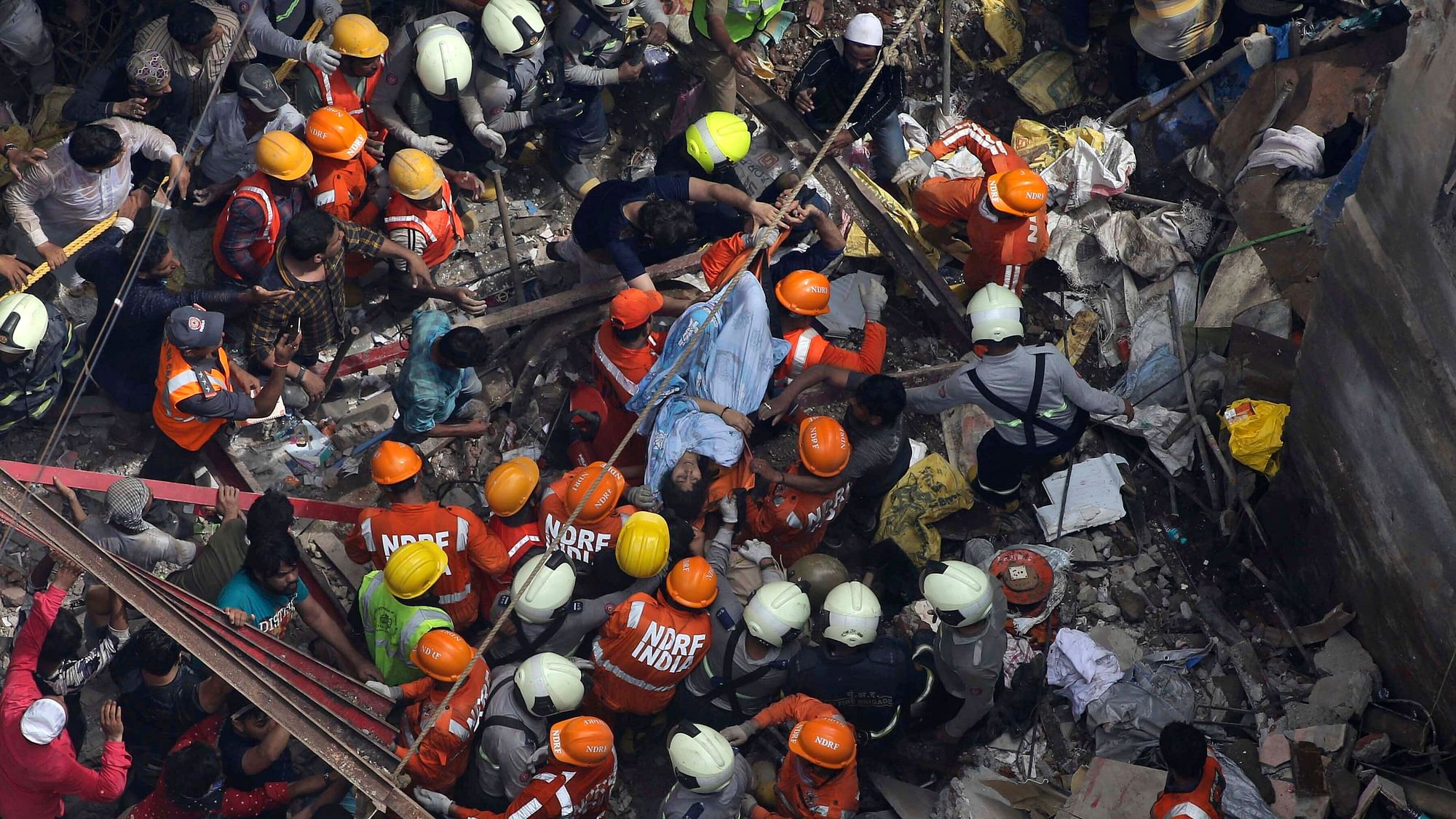 About 40 to 50 people are feared trapped under the debris of the Dongri building that collapsed on Tuesday morning.
