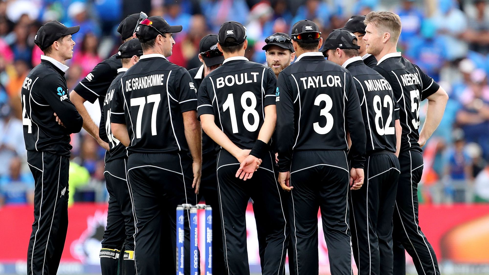 New Zealand players in a huddle during the semifinal against India.