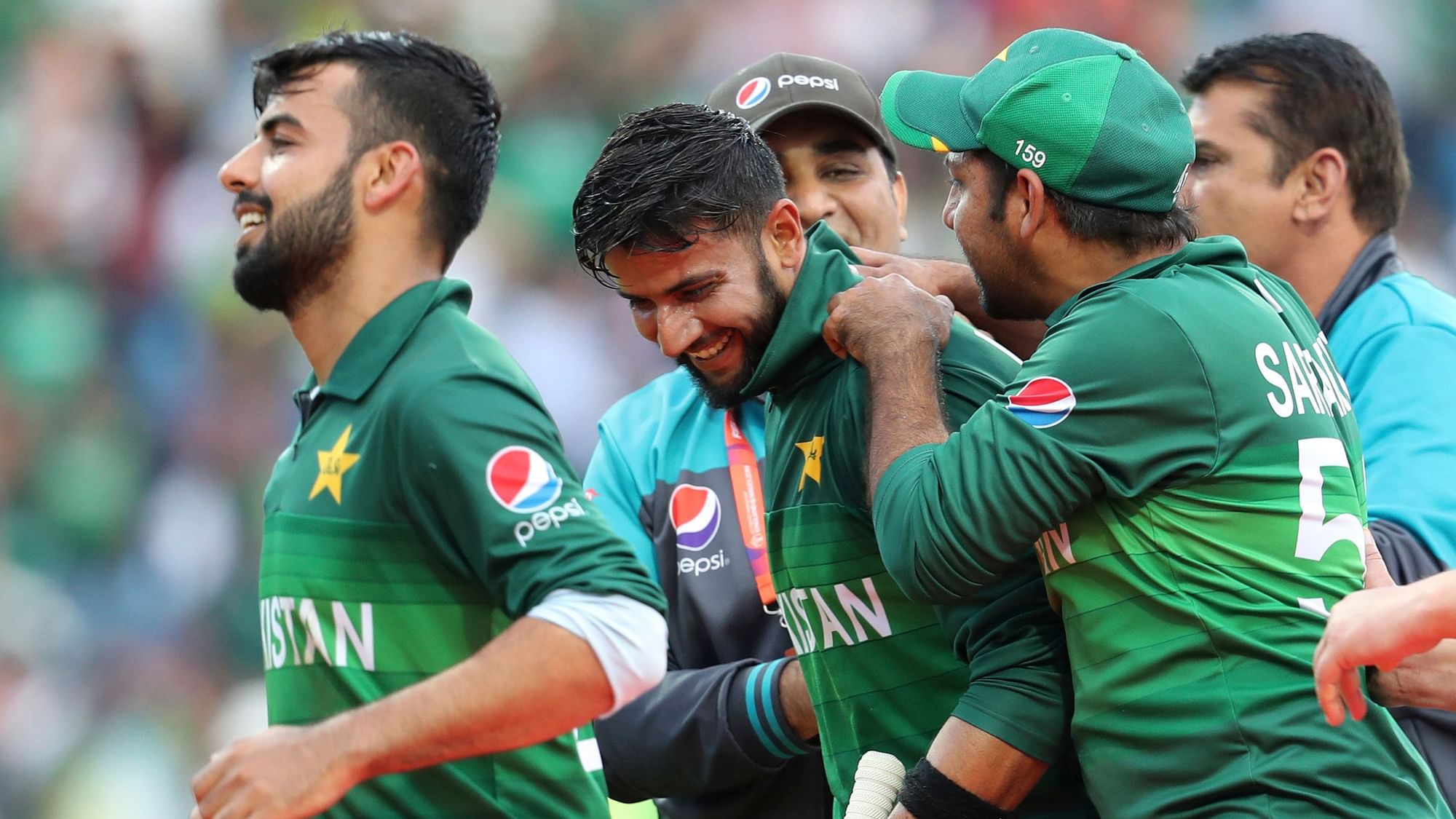 Pakistani cricketers celebrate their team’s victory in the Cricket World Cup match between Pakistan and Afghanistan.