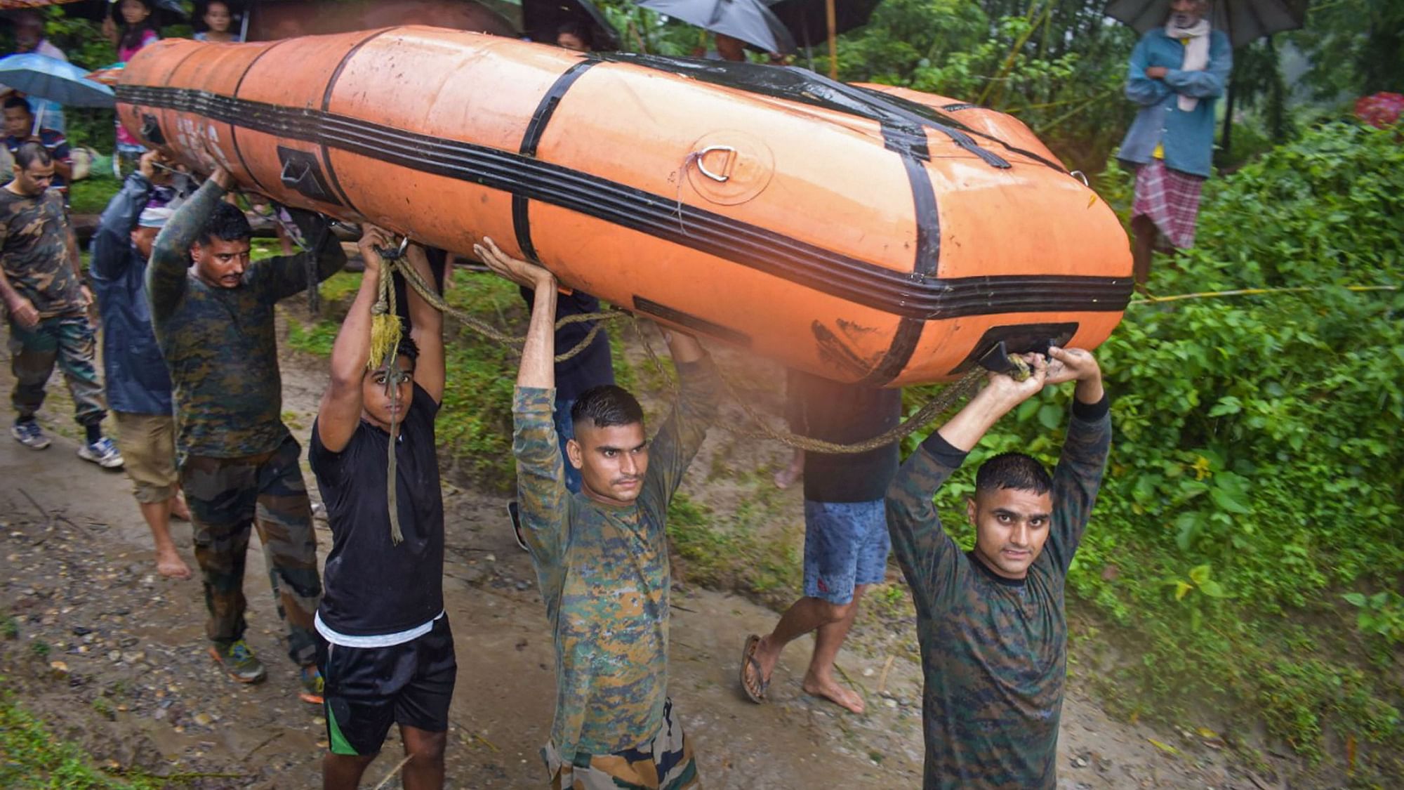 The Indian Army carry out a rescue operation in the flooded village of Baksa district in Assam.