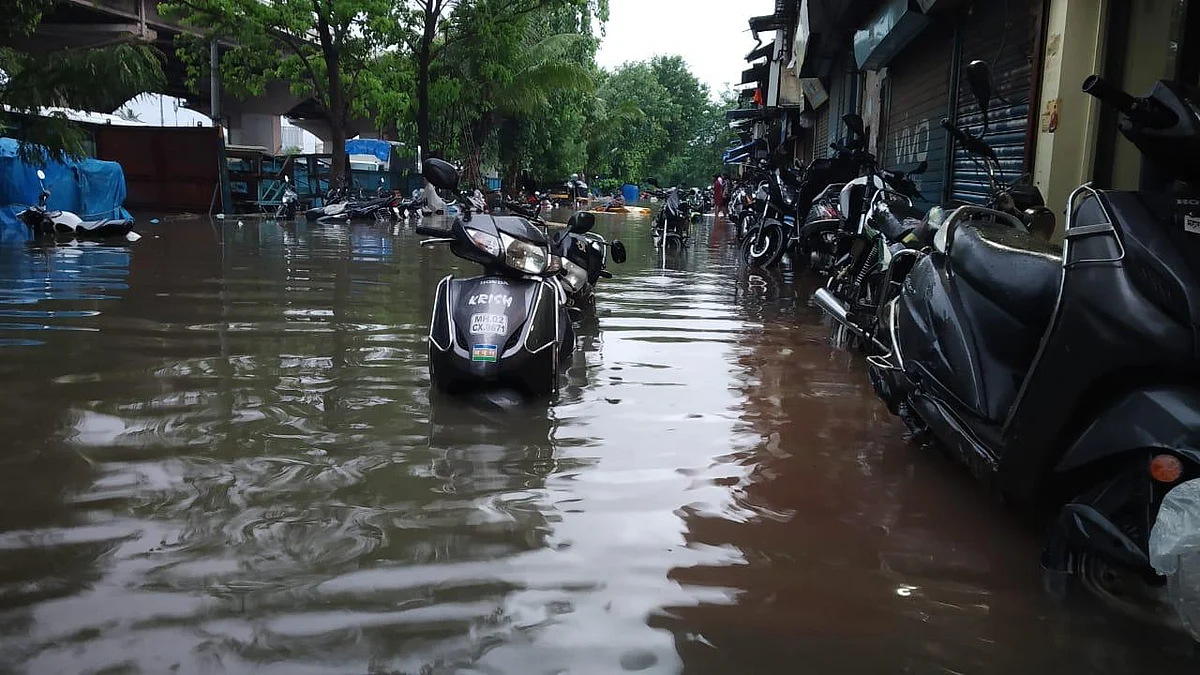 Scooters submerged in water at Hanuman Tekdi Service Road in Santacruz East.
