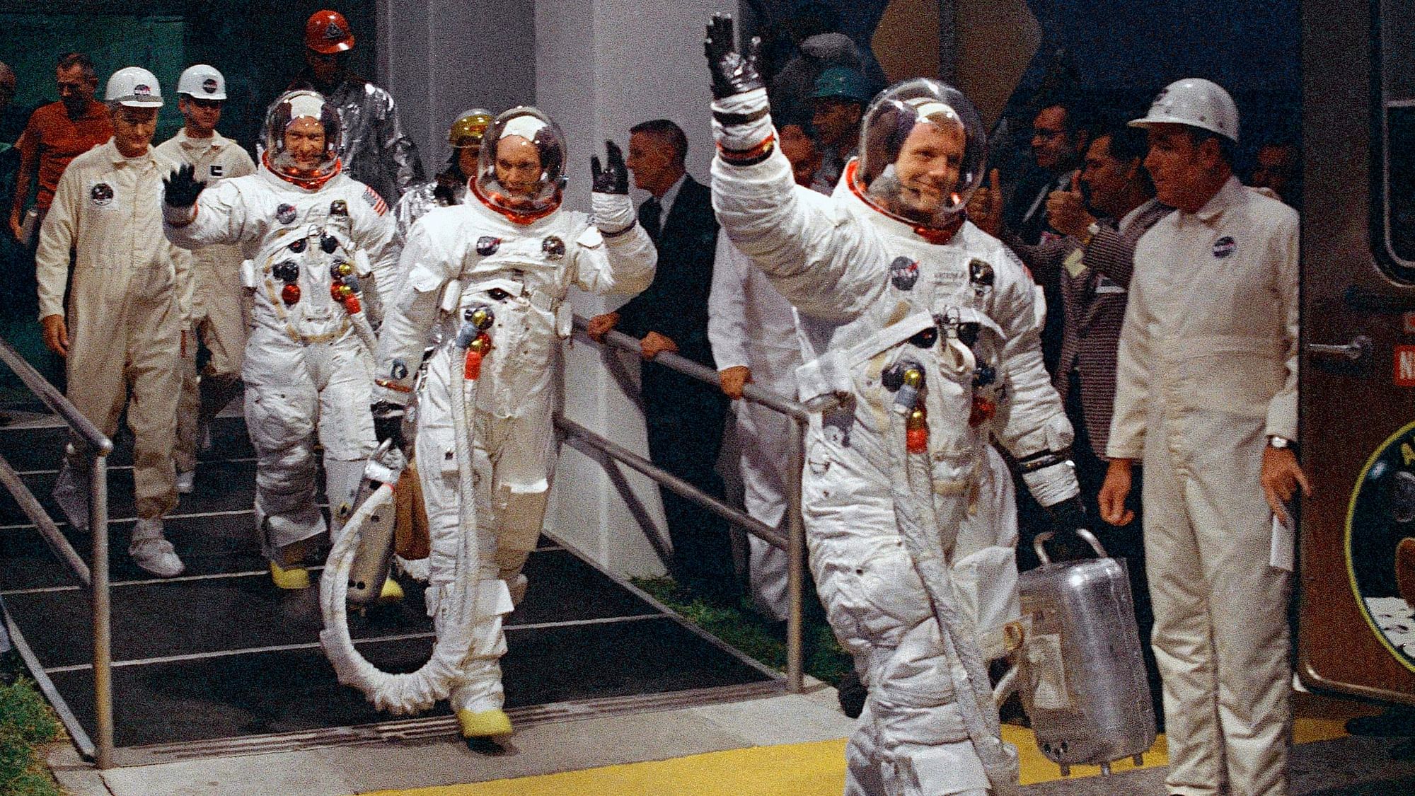 In this July 16, 1969 file photo, from right, Neil Armstrong, Michael Collins and Buzz Aldrin walk to the van that will take the crew to the launchpad at Kennedy Space Center on Merritt Island, Florida.&nbsp;