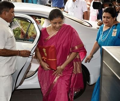 New Delhi: Union Finance Minister Nirmala Sitharaman arrives at Parliament to present the Union Budget 2019, in New Delhi on July 5, 2019. Setting a new precedent Union Finance Minister Nirmala Sitharaman on Friday is seen hugging the budget documents wrapped in a red cloth, the traditional