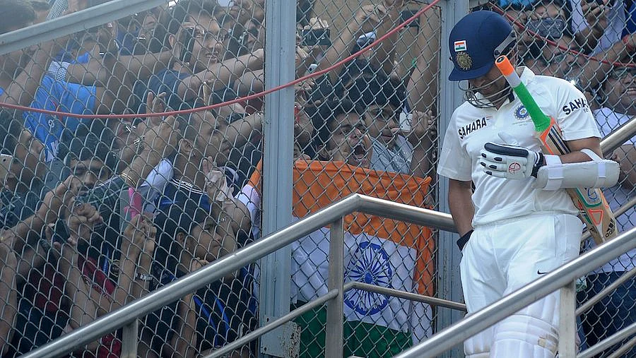 Sachin Tendulkar walks out to bat.