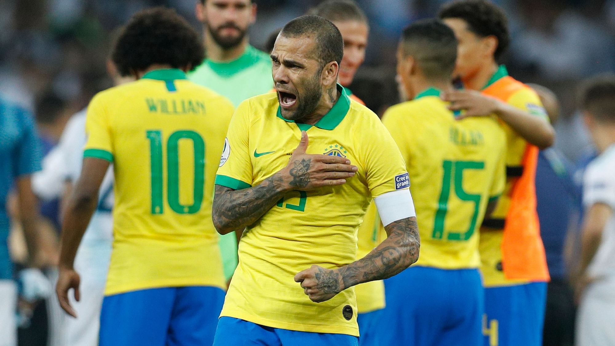 Brazil’s Dani Alves celebrates his team’s 2-0 victory over Argentina at the end of their Copa America semifinal soccer match at Mineirao stadium in Belo Horizonte.
