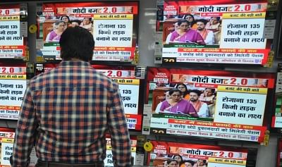 Kolkata: People busy watching the telecast of the presentation of Union Budget 2019 by Union Finance Minister Nirmala Sitharaman in the Lok Sabha; at an electronics showroom in Kolkata on July 5, 2019. (Photo: Kuntal Chakrabarty/IANS)