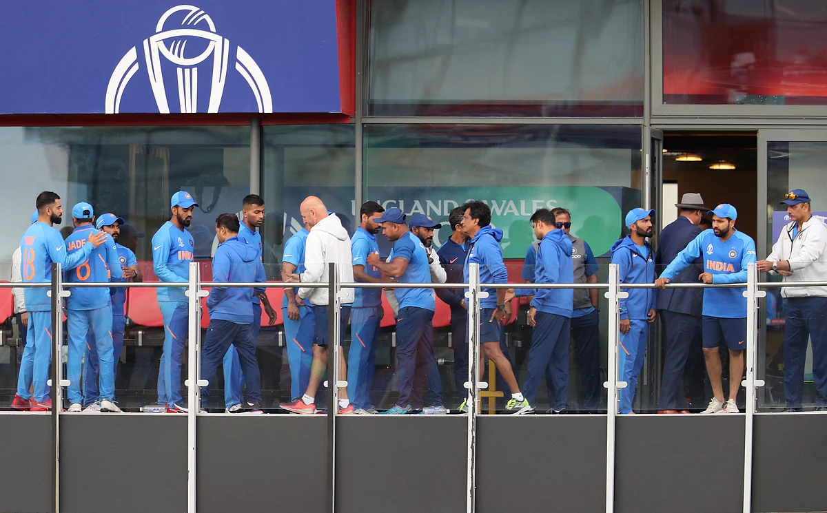 Indian cricketers react after their team lost the Cricket World Cup semifinal match between India and New Zealand at Old Trafford in Manchester, Wednesday, July 10, 2019. 