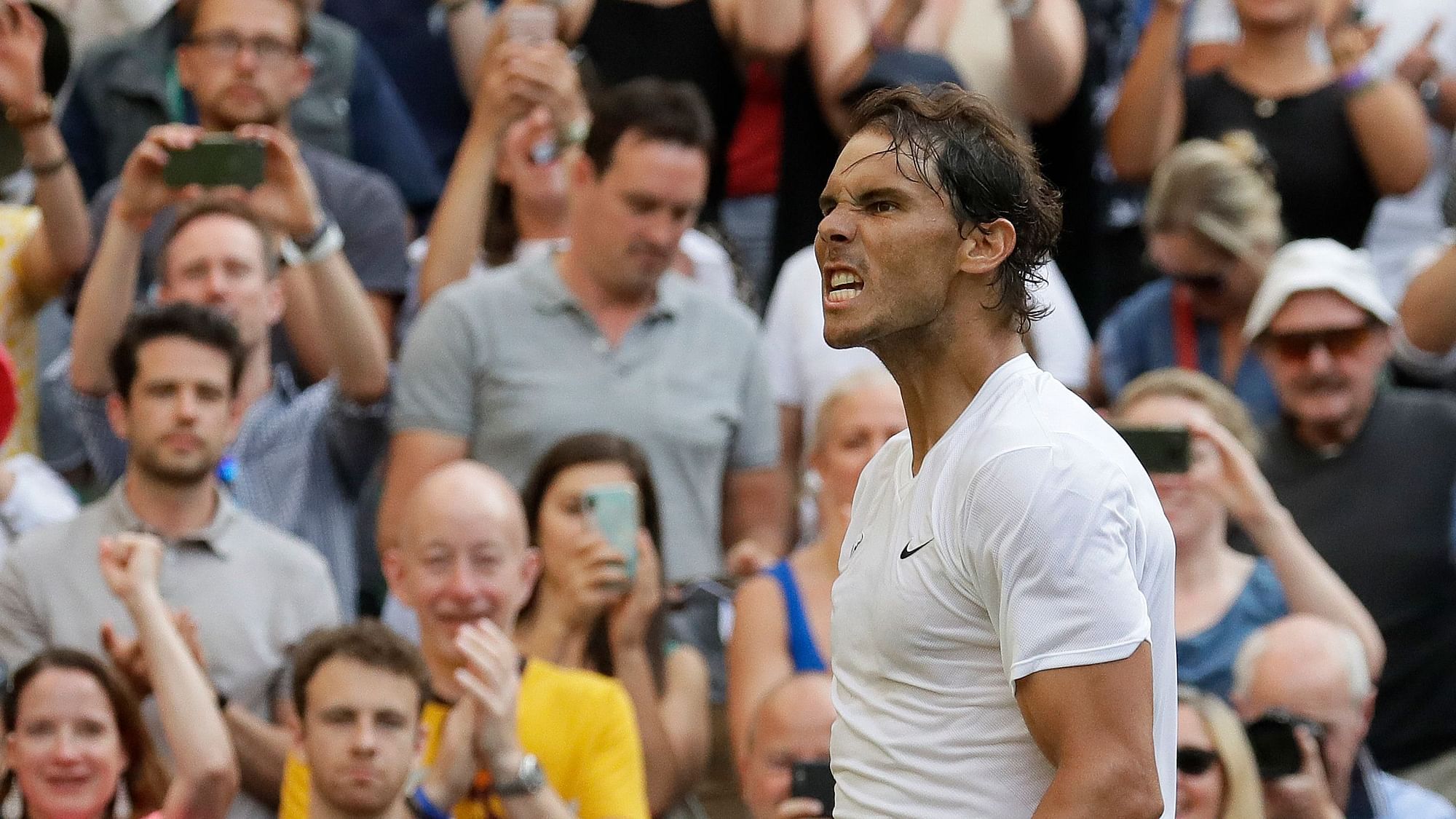 Rafael Nadal celebrates after beating Nick Kyrgios in the second round of the 2019 Wimbledon.
