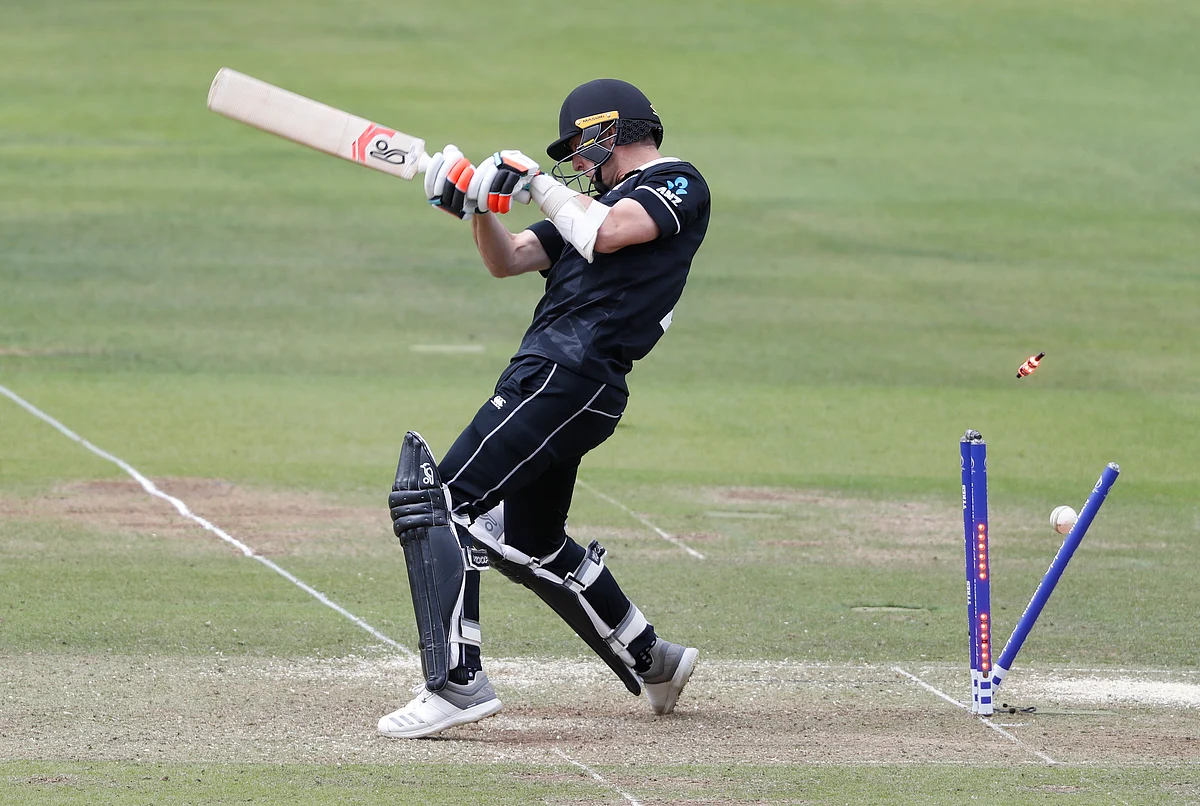 New Zealand’s Matt Henry is clean bowled by England’s Jofra Archer during the Cricket World Cup final.