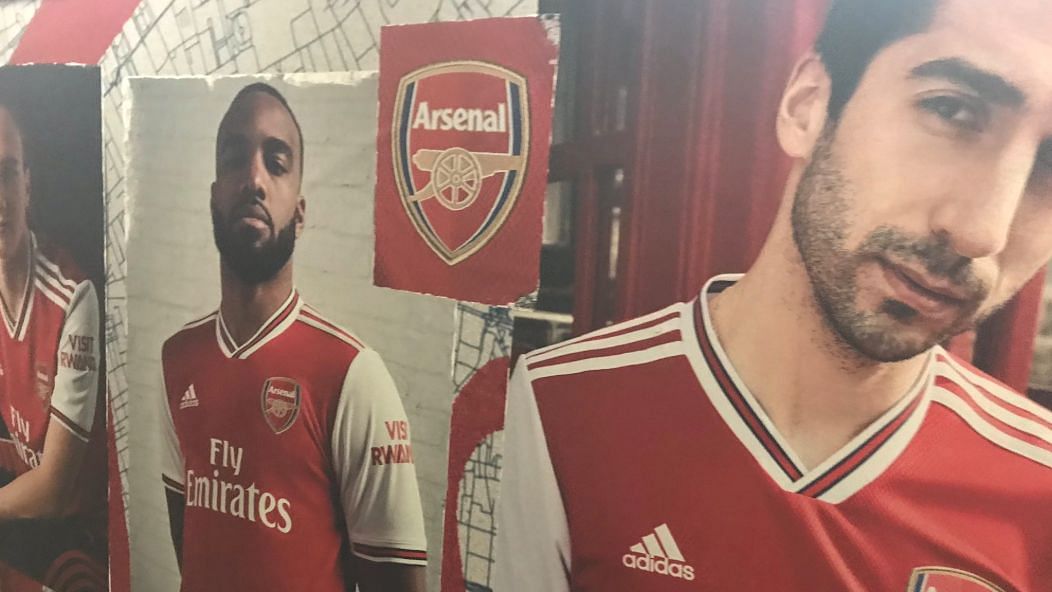 A promotional poster of new Arsenal T-shirt by Adidas