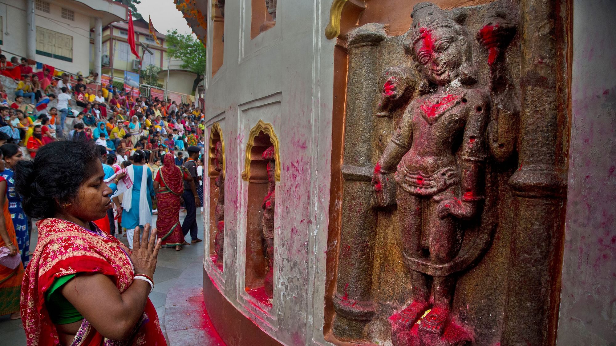 Monika Deb Nath, 45, offers prayers at the Kamakhya temple during the Ambubachi festival in Guwahati, India.