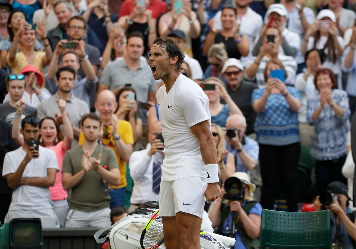 Rafael Nadal celebrates after beating Nick Kyrgios in the second round of the 2019 Wimbledon.
