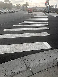 The pedestrian crossing to the foot bridge.
