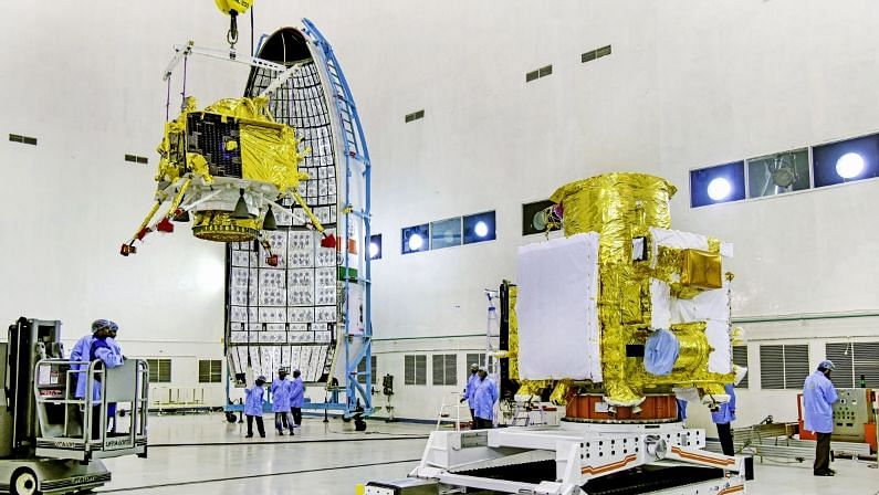 Officials carry out the hoisting of the Vikram Lander during the integration of Chandrayaan-2.