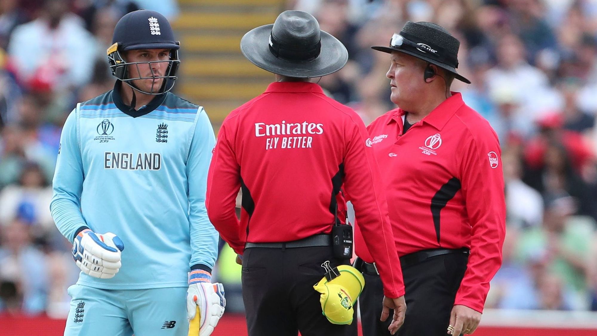 England’s Jason Roy, left, interacts with the umpires after he was given out during the Cricket World Cup semi-final match between England and Australia at Edgbaston in Birmingham, England, Thursday, July 11, 2019. 