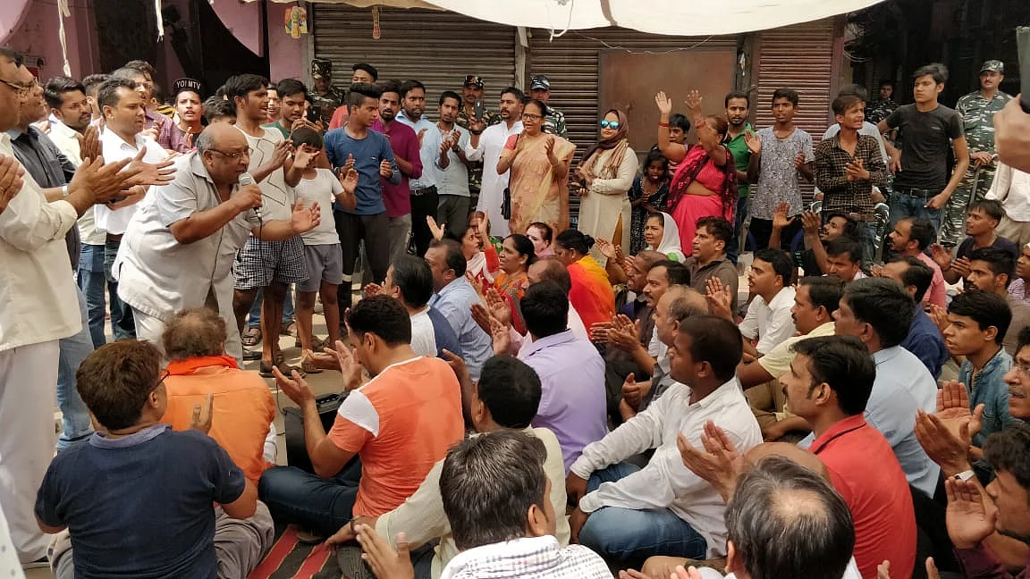 People outside temple demanding action against the culprits.