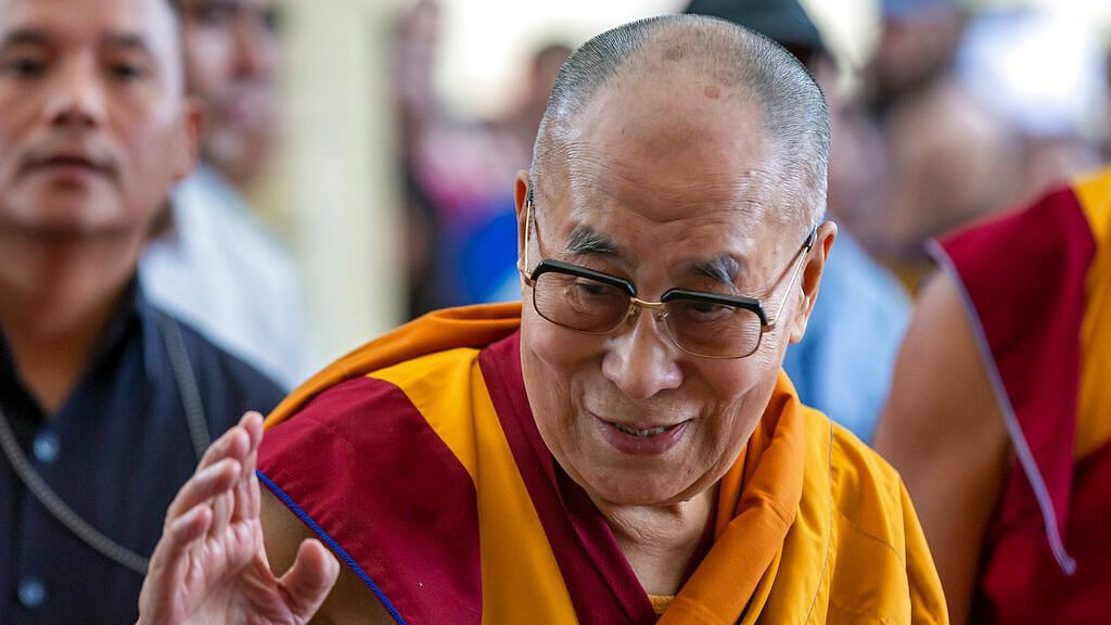 Tibetan spiritual leader the Dalai Lama greets devotees as he arrives at the Tsuglakhang temple in Dharmsala on 5 July 2019.&nbsp;