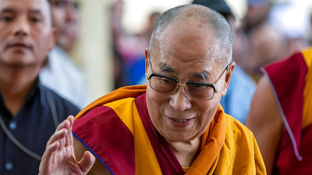 Tibetan spiritual leader the Dalai Lama greets devotees as he arrives at the Tsuglakhang temple in Dharmsala on 5 July 2019. 